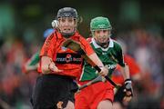 6 December 2009; Mary O'Kane, Lavey, goes past Lorena Mooney, St Anne's Dunhill, on the way to scoring her side's first goal. All-Ireland Junior Camogie Club Championship Final, Lavey, Derry, v St Anne's Dunhill, Waterford, Donaghmore Ashbourne, Co. Meath. Picture credit: Brian Lawless / SPORTSFILE