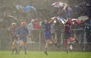 6 December 2009; Paula Bulfin, Cashel, in action against Noreen Coen, Athenry, during heavy rain fall. All-Ireland Senior Camogie Club Championship Final, Athenry, Galway v Cashel, Tipperary, Clarecastle GAA Club, Clarecastle, Co. Clare. Picture credit: Diarmuid Greene / SPORTSFILE