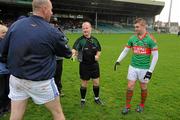 6 December 2009; Kerins O'Rahilly's captain Michael Quirke shakes hands with Enda Coughlan, Kilmurray Ibrickane, and referee Maurice Condon before the game. AIB GAA Football Munster Club Senior Championship Final, Kilmurray Ibrickane, Clare, v Kerins O'Rahilly's, Kerry. Gaelic Grounds, Limerick. Picture credit: Pat Murphy / SPORTSFILE