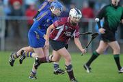 6 December 2009; Regina Glynn, Athenry, in action against Claire Grogan, Cashel. All-Ireland Senior Camogie Club Championship Final, Athenry, Galway v Cashel, Tipperary, Clarecastle GAA Club, Clarecastle, Co. Clare. Picture credit: Diarmuid Greene / SPORTSFILE