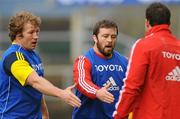 8 December 2009; Munster's Jerry Flannery, left, and Marcus Horan offer a handshake to team-mate Wian Du Preez after a training drill during squad training ahead of their Heineken Cup game against Perpignan on Friday. Munster Rugby Squad Training, Thomond Park, Limerick. Picture credit: Diarmuid Greene / SPORTSFILE