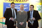 8 December 2009; Trevor Harding, left, is presented with the Doc Jackson Memorial Trophy as National Forestry Rally Champion Driver, while Andrew Purcell, right, receives the National ForestryRally Champion Navigator award from James Coleman, Chairman of the Rallies Committee, during the Dunlop Champions of Irish Motorsport Awards Lunch 2009. Dunlop Champions of Irish Motorsport Awards Lunch 2009, The Crowne Plaza Hotel, Santry, Dublin. Picture credit: Pat Murphy / SPORTSFILE