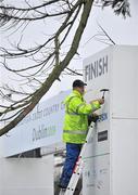 9 December 2009; Sports Management's Rob Lloyd, from Anfield, Liverpool, puts the finishing touches to the Finish Line ahead of the SPAR European Cross Country Championships. Santry Demesne, Santry, Co. Dublin. Picture credit: Brian Lawless / SPORTSFILE