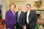 9 December 2009; Paul Brady, right, member of the 2009 Irish Handball team, who recently became newly crowned World Handball Champions, with President Mary McAleese and President of the Handball Association Tony Hannon, centre, during a visit to Áras an Uachtaráin, Phoenix Park, Dublin. Picture credit: David Maher / SPORTSFILE