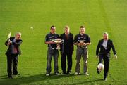 10 December 2009; Student GAA stars Ross O'Carroll, Dublin / UCD, left, and Daniel Goulding, Cork / CIT, right, are pictured pitch side in Croke Park with Ard Stiúrthoir Lúthchleas Gael Paraic Duffy, centre, Michael Mallie, Chairman of Higher Education, GAA, extreme left, Sean Martyn, Director, Business Banking Area East, Ulster Bank, extreme right, as the 2010 Higher Education Championship draws took place. Cork Institute of Technology and University College Cork will defend their respective Ulster Bank Sigerson and Fitzgibbon Cup crowns in the highly anticipated 2010 Championships. Over 100 teams will be battling it in all divisions for a place at the finals weekend hosted by NUI Maynooth (football) and NUI Galway (hurling). 2010 Ulster Bank Sigerson and Fitzgibbon Cup Draws, Croke Park, Dublin. Picture credit: Pat Murphy / SPORTSFILE