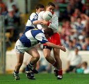 27 September 1998; Richard Thornton of Tyrone is tackled by Eoin Bland of Laois during the All-Ireland Minor Football Championship Final match between Laois and Tyrone at Croke Park in Dublin. Photo by Matt Browne/Sportsfile
