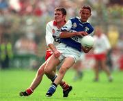 27 September 1998; Tom Kelly of Laois is tackled by Aidan Ball of Tyrone during the All-Ireland Minor Football Championship Final match between Laois and Tyrone at Croke Park in Dublin. Photo by Matt Browne/Sportsfile