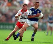 28 September 1998; Tom Kelly of Laois is tackled by Aidan Ball of Tyrone during the All-Ireland Minor Football Championship Final match between Laois and Tyrone at Croke Park in Dublin. Photo by Matt Browne/Sportsfile