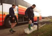 19 March 2001; Jason McAteer, left, looks on as Robbie Keane dips his boots into a tray containing disinfectant as a precautionary measure against Foot and Mouth disease before a Republic of Ireland training session at the AUL Complex in Clonshaugh in Dublin. Photo by David Maher/Sportsfile