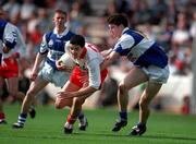 28 September 1997; Darren O'Henlon of Tyrone in action against Mark Hovenden of Laois during the All-Ireland Minor Football Championship Final match between Laois and Tyrone at Croke Park in Dublin. Photo by Ray McManus/Sportsfile