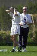 21 March 2001; Roy Keane puts on some sun block with Mick Byrne, team physio in the backround during a Republic of Ireland training session in Limassol, Cyprus. Photo by Damien Eagers/Sportsfile