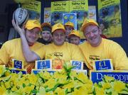 23 March 2001; Ireland rugby players Denis Hickie, Peter Clohessy and Mick Galwey with students from the Catherine McAuley National School on Baggott Street during Daffodil Day. Photo by Matt Browne/Sportsfile