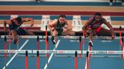9 March 2001; Peter Coghlan of Ireland, centre, in action against Terence Trammell USA, left, and Anier Garcia of Cuba in the Men's 60m Hurdles during the World Indoor Athletics Championship at the Atlantic Pavillion in Lisbon, Portugal. Photo by Brendan Moran/Sportsfile