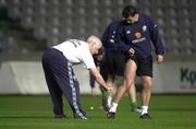 23 March 2001; Republic of Ireland team physio Mick Byrne sprays Ian Harte's leg to prevent insect bites during a Republic of Ireland training session at the GSP Stadium in Nicosia, Cyprus. Photo by David Maher/Sportsfile