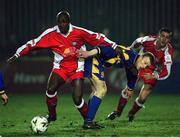 23 March 2001; Mbabazi Livingstone of St Patrick's Athletic in action against Keith O'Connor of Longford Town during the FAI Harp Lager Cup Third Round Replay match between St Patrick's Athletic and Longford Town at Richmond Park in Dublin. Photo by Matt Browne/Sportsfile