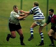 24 March 2001; Ultan O'Callaghan of Cork Constitution is tackled by Stephen Bell of Dungannon during the AIB All-Ireland League Division 1 match between Dungannon RFC and Cork Constitution RFC at Dungannon RFC in Tyrone. Photo by Matt Browne/Sportsfile