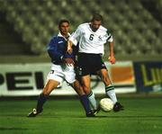 24 March 2000; Roy Keane of Republic of Ireland scores his side's fourth goal despite the tackle from Marios Christodoulou of Cyprus during the 2002 FIFA World Cup Qualification Group 2 match between Cyprus and Republic of Ireland at GSP Stadium in Nicosia, Cyprus. Photo by Damien Eagers/Sportsfile