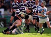 25 March 2001; Killian Coleman of Terenure College is tackled by Mark Whelan, left, and team-mate Andrew Whelan of Blackrock College during the Leinster Schools Schools Cup Final match between Blackrock College and Terenure College at Landowne Road in Dublin. Photo by Aoife Rice/Sportsfile
