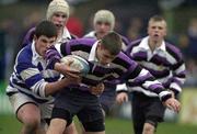 26 March 2001; Enda Farrell of Terenure College is tackled by Eoin O'Keeffe of Blackrock College during the Leinster Schools Schools Junior Cup Semi-Final match between Blackrock College and Terenure College at Donnybrook Stadium in Dublin. Photo by Brendan Moran/Sportsfile