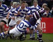 26 March 2001; Karl Douglas of Terenure College is tackled by David Cullen, 10, of Blackrock College during the Leinster Schools Schools Junior Cup Semi-Final match between  Blackrock College v Terenure College at Donnybrook Stadium in Dublin. Photo by Brendan Moran/Sportsfile