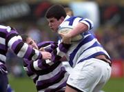 26 March 2001; Eoin O'Keeffe of Blackrock College is tackled by Conor Hagan of Terenure College during the Leinster Schools Schools Junior Cup Semi-Final match between  Blackrock College v Terenure College at Donnybrook Stadium in Dublin. Photo by Brendan Moran/Sportsfile