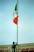 27 March 2001; A stadium official raises the tricolour before a Republic of Ireland training session at the Mini Estadi in Barcelona, Spain. Photo by Damien Eagers/Sportsfile