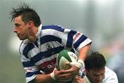 24 March 2001; Tyrone Howe of Dungannon is tackled by John Kelly of Cork Constitution during the AIB All-Ireland League Division 1 match between Dungannon RFC and Cork Constitution RFC at Dungannon RFC in Tyrone. Photo by Matt Browne/Sportsfile