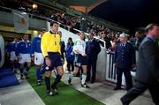 24 March 2001; Team captains Roy Keane of Republic of Ireland and Nikos Panayiotov of Cyprus lead their teams out before the 2002 FIFA World Cup Qualification Group 2 match between Cyprus and Republic of Ireland at GSP Stadium in Nicosia, Cyprus. Photo by Damien Eagers/Sportsfile