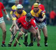 1 April 2001; Pat Ryan of Cork in action against Paul Codd, left, and Michael Jordan of Wexford during the Allianz GAA National Hurling League Division 1B Round 4 match between Wexford and Cork at at Bellefield in Enniscorthy, Wexford. Photo by Aoife Rice/Sportsfile