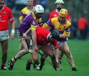 1 April 2001; Pat Ryan of Cork in action against Paul Codd, left, and Michael Jordan of Wexford during the Allianz GAA National Hurling League Division 1B Round 4 match between Wexford and Cork at at Bellefield in Enniscorthy, Wexford. Photo by Aoife Rice/Sportsfile