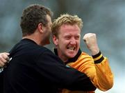 1 April 2001; David Mooney of Portmarnock celebrates with a team official after the FAI Lager Cup Third Round match between Portmarnock and Dundalk at John Hyland Park in Dublin, as a precautionary measure against Foot and Mouth disease. Photo by David Maher/Sportsfile