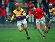 1 April 2001; Colm Byrne of Wexford in action against John Browne of Cork during the Allianz GAA National Hurling League Division 1B Round 4 match between Wexford and Cork at at Bellefield in Enniscorthy, Wexford. Photo by Aoife Rice/Sportsfile