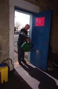 31 March 2001; &quot;Kinger&quot; Pat King, a member of the ground staff at Semple Stadium, sprays disinfectant on to a matt at an entrance in an effort to stop the spread of Foot and Mouth Disease before the AIB All-Ireland Senior Club Hurling Championship Semi-Final Replay match between Graigue Ballycallan and Sixmilebridge at Semple Stadium in Thurles, Tipperary. Photo by Ray McManus/Sportsfile