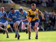 31 March 2001; Niall Gilligan of Sixmilebridge races away from Paddy O'Dwyer of Grague Ballycallan during the AIB All-Ireland Senior Club Hurling Championship Semi-Final Replay match between Graigue Ballycallan and Sixmilebridge at Semple Stadium in Thurles, Tipperary. Photo by Ray McManus/Sportsfile