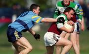 4 April 2001; John Heavney of St Mary's is tackled by Stephen Lucey of UCD during the Sigerson Cup match between UCD and St Mary's at Walterstown GFC in Navan, Meath. Photo by Aoife Rice/Sportsfile