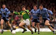 1 April 2001; Éamonn Fitzmaurice of Kerry in action against Dublin players, from left, Colin Moran, Niall O'Donoghue and Ciarán Whelan of Dublin during the Allianz National Football League Division 1 match between Kerry and Dublin at Fitzgerald Stadium in Killarney, Kerry. Photo by Brendan Moran/Sportsfile