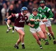 1 April 2001; James Butler of Limerick is tackled by Ollie Canning of Galway during the Allianz National Hurling League Division 1A Round 4 match between Galway and Limerick at Duggan Park in Ballinasloe, Galway. Photo by Damien Eagers/Sportsfile