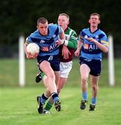 4 April 2001; Noel Maguire of UCD is tackled by Kevin Coary of St Mary's during the Sigerson Cup match between UCD and St Mary's at Walterstown GFC in Navan, Meath. Photo by Aoife Rice/Sportsfile