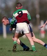 4 April 2001; Nigel Crawford of UCD is tackled by Ciaran Meenagh of St Mary's during the Sigerson Cup match between UCD and St Mary's at Walterstown GFC in Navan, Meath. Photo by Aoife Rice/Sportsfile