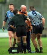8 April 2001; Jonathan Magee of Dublin is attended to by Dublin team Doctor Dr Noel McCaffrey before being substituted during the Allianz GAA National Football League Division 1A match between Dublin and Galway at Parnell Park in Dublin. Photo by Ray McManus/Sportsfile