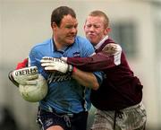 8 April 2001; Vinnie Murphy of Dublin is tackled by Michael Comer of Galway during the Allianz GAA National Football League Division 1A match between Dublin and Galway at Parnell Park in Dublin. Photo by Aoife Rice/Sportsfile