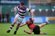 9 February 2016; Thomas Monaghan, Clongowes Wood College, escapes the tackle of Eoghan Clarke, CBC Monkstown. Bank of Ireland Leinster Schools Senior Cup 2nd Round, Clongowes Wood College v CBC Monkstown. Donnybrook Stadium, Donnybrook, Dublin. Picture credit: Brendan Moran / SPORTSFILE
