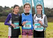11 February 2016; Second place Tara Ramasawmy, left, Presentation Waterford, first place Lucy Holmes, centre, Ard Scoil na nDéise, and third place Alyce O'Connor, right, Pobal Scoil Inbhearsceine Kenmare, hold their medals following the Junior Girls event. GloHealth Munster Schools Cross Country, Tramore Valley Park, Cork City. Picture credit: Seb Daly / SPORTSFILE