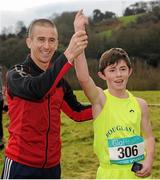 11 February 2016; Junior Boys event winner Chris O'Reilly, right, Douglas Community School, is presented with his medal by Republic of Ireland athlete Rob Heffernan following the race. GloHealth Munster Schools Cross Country, Tramore Valley Park, Cork City. Picture credit: Seb Daly / SPORTSFILE