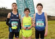 11 February 2016; Second place Jake Bugg, left, Ardscoil na Mara Tramore, first place Chris O'Reilly, centre, Douglas Community School, and third place Finn Looney, right, St Annes CC Killaloe, hold their medals following the Junior Boys event. GloHealth Munster Schools Cross Country, Tramore Valley Park, Cork City. Picture credit: Seb Daly / SPORTSFILE