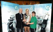 10 December 2009; Mount St Michael Claremorris, Mayo, captain Ashling Croghan is presented with the Ryan cup by Bob Sinnott, Vice-President Volleyball Association of Ireland, left, and Johann Cardiff, Women’s National Squads Head Coach, after victory over St Leo's College Carlow. VAI Schools Senior Volleyball Finals 2009, Senior Girls 'A' Final, UCD Sports Centre, Belfield, Dublin. Picture credit: Stephen McCarthy / SPORTSFILE