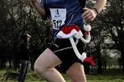 12 December 2009; A general view of a competitor in action during the Aware 10K Christmas Fun Run 2009. The Phoenix Park, Dublin. Picture credit: Tomas Greally / SPORTSFILE