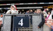 12 December 2009; Two supporters watch on during the game. Allianz Cumann na mBunscol Finals, Corn Uí Shuíocháin, St. Laurence O’Toole’s v Our Lady of Consolation, Donnycarneyn, Croke Park, Dublin. Photo by Sportsfile  *** Local Caption ***