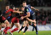 12 December 2009; Nathan Hines, Leinster, is tackled by Simon Easterby and Jonathan Davies, Llanelli Scarlets. Heineken Cup Pool 6 Round 3, Llanelli Scarlets v Leinster, Parc Y Scarlets, Llanelli, Wales. Picture credit: Matt Browne / SPORTSFILE