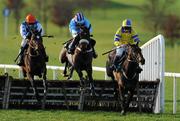 13 December 2009; Moville, left, with Patrick Flood up, jumps the last on their way to winning the Kells Hurdle ahead of 2nd place Der Spieler, right, with Garrett Cotter up, and 3rd place Rubi Light, with Philip Carberry up. Navan Racecourse, Proudstown, Navan, Co. Meath. Photo by Sportsfile